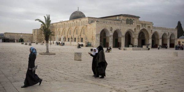 In this photo taken on Monday, Jan. 27, 2014, Palestinian women walk at the al-Aqsa mosque compound in Jerusalem. The mosque's library has a collection of some 4,000 old manuscripts with about a quarter considered in poor condition. Half of the books are already undergoing restoration funded by the Waqf, Jordan’s Islamic authority which manages the holy site, and with assistance from UNESCO. (AP Photo/Dusan Vranic)